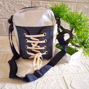 ini adalah Tasel Sepatu Navy, size: 18 cm x 13 cm, material: Canvas, color: nevy and white, brand: Tasslempangindo, age_group: all ages, gender: unisex